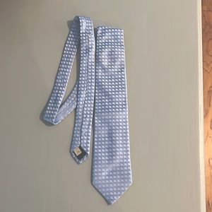 Burberry 100% silk blue tie with silver logo all over
